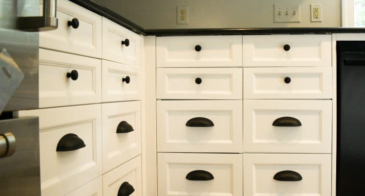 white kitchen cabinets with black drawer handles