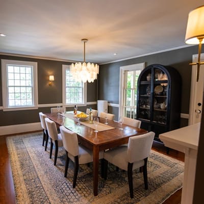 interior painting project in Wellesley, Massachusetts of reading room featuring a grey walla and white ceiling completed by H.D.F. Painting Interior Painters.
