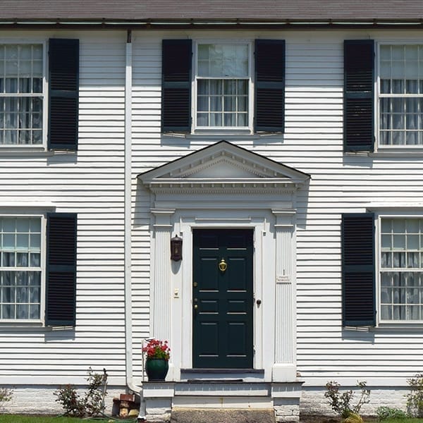 historic house with green door and black shutters
