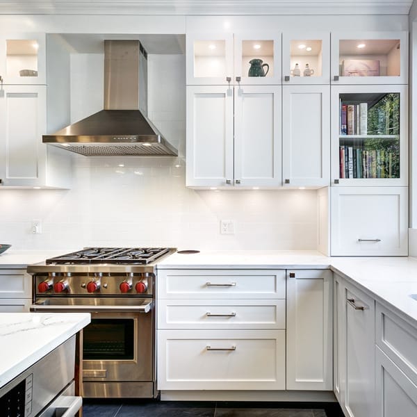 white kitchen cabinets, stove